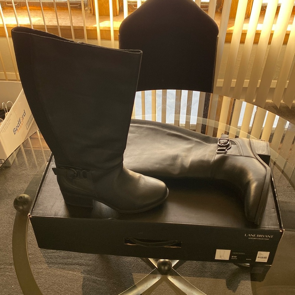 Lane Bryant Black knee high riding boots.